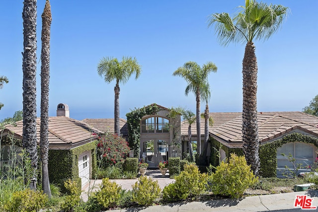 view of front of home with french doors and a garage