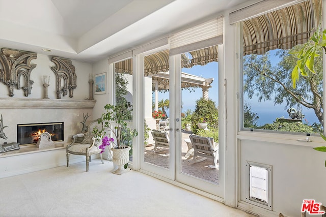 doorway to outside with french doors and carpet floors