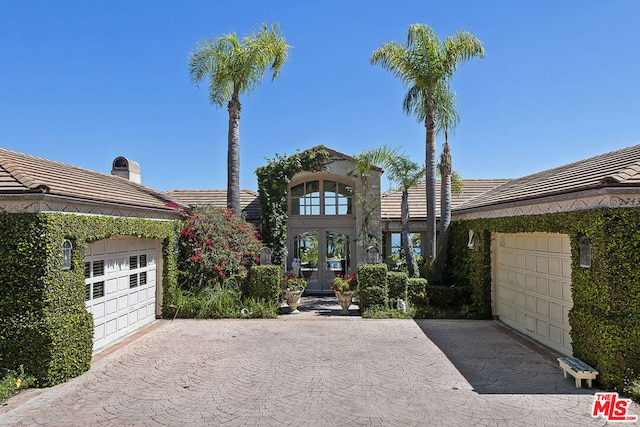 view of front of property with a garage