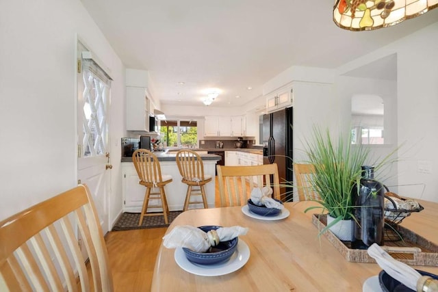 dining room with light hardwood / wood-style flooring