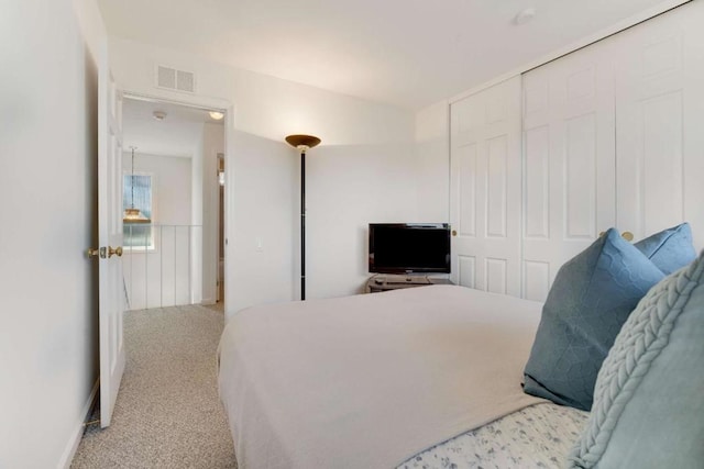 bedroom with a closet and carpet floors