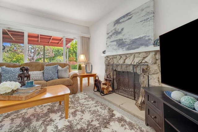 sitting room with a fireplace and light colored carpet