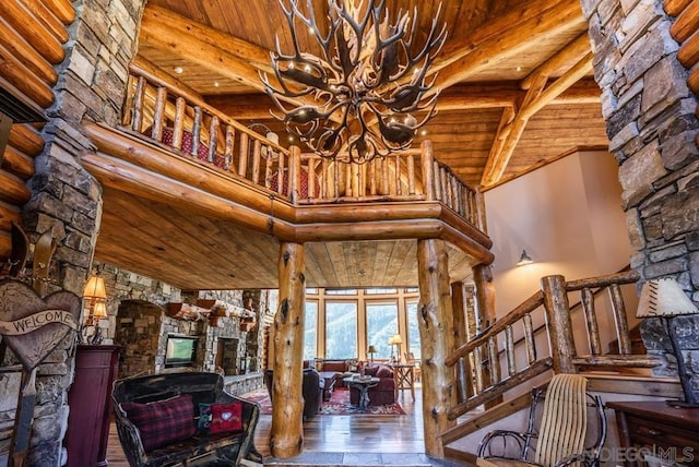 staircase featuring high vaulted ceiling, an inviting chandelier, wooden ceiling, beamed ceiling, and dark hardwood / wood-style flooring