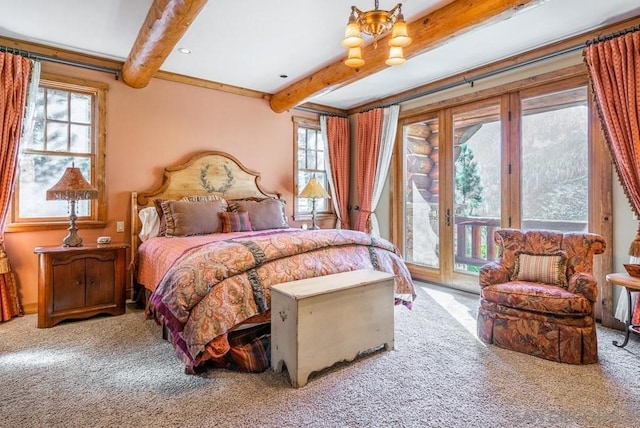 carpeted bedroom with access to outside, beam ceiling, and multiple windows