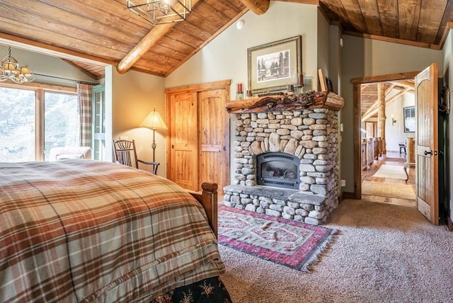 carpeted bedroom featuring lofted ceiling with beams, a fireplace, wooden ceiling, and a chandelier