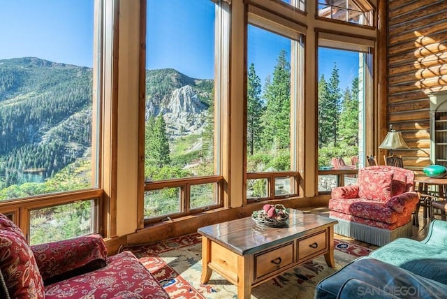 sunroom featuring a mountain view