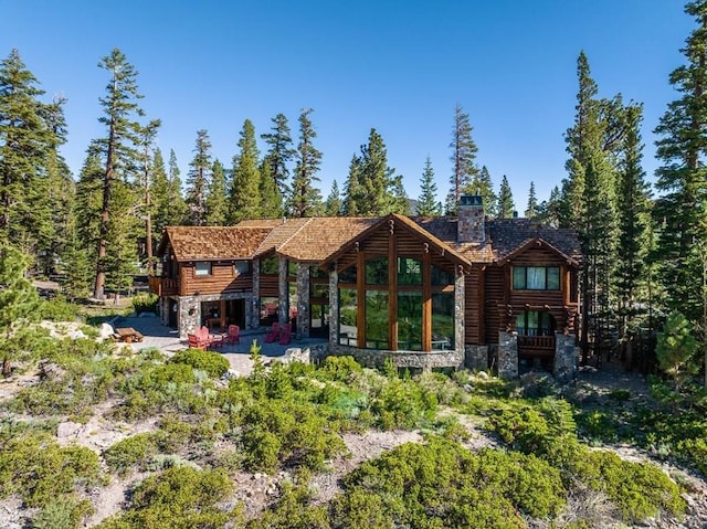 rear view of property with a patio area