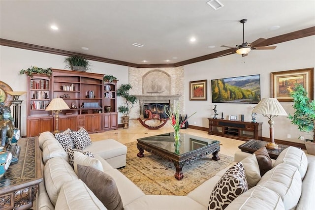 living room with ceiling fan, a large fireplace, and light tile floors