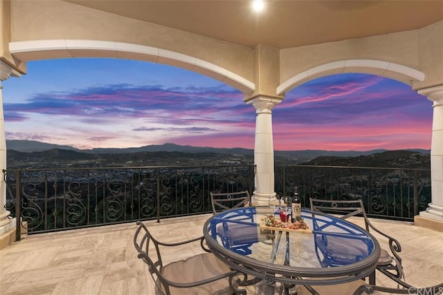 patio terrace at dusk with a mountain view