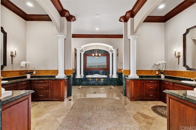 bathroom featuring tasteful backsplash, crown molding, decorative columns, tile flooring, and an inviting chandelier