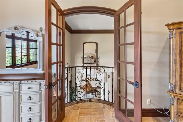 hall with french doors and ornamental molding