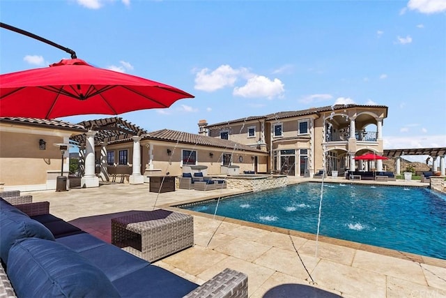 view of pool with pool water feature, a patio area, and an outdoor living space