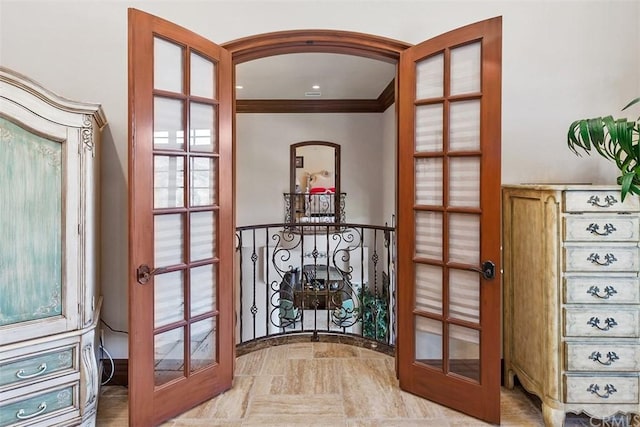 interior space featuring ornamental molding, light tile floors, and french doors