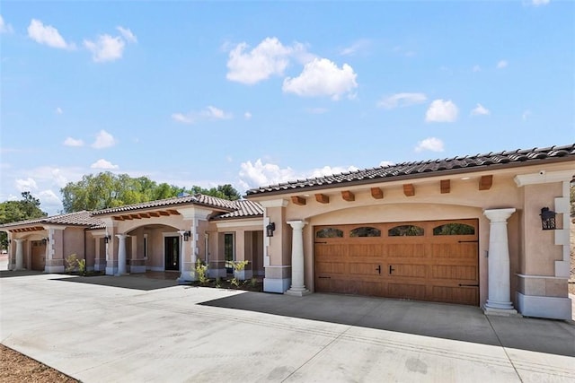 mediterranean / spanish-style house featuring a garage