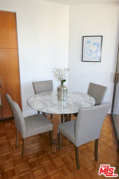 dining room with dark parquet floors