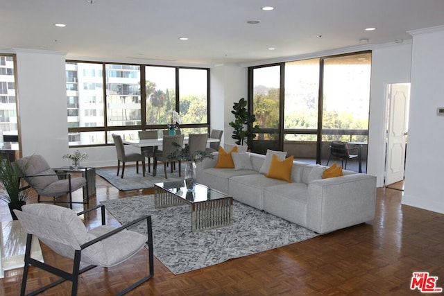 living room with a wall of windows and dark parquet flooring