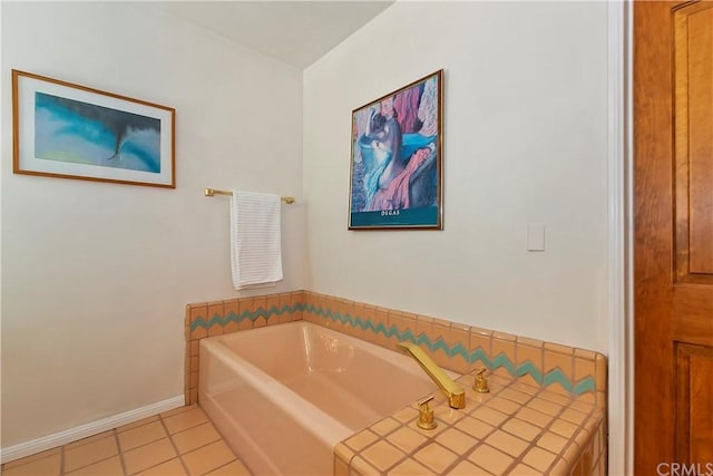 bathroom featuring tile patterned floors and a tub to relax in