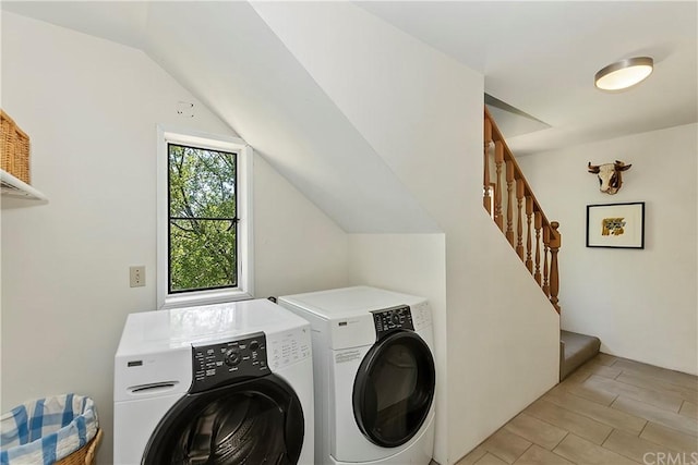 laundry room with washing machine and clothes dryer