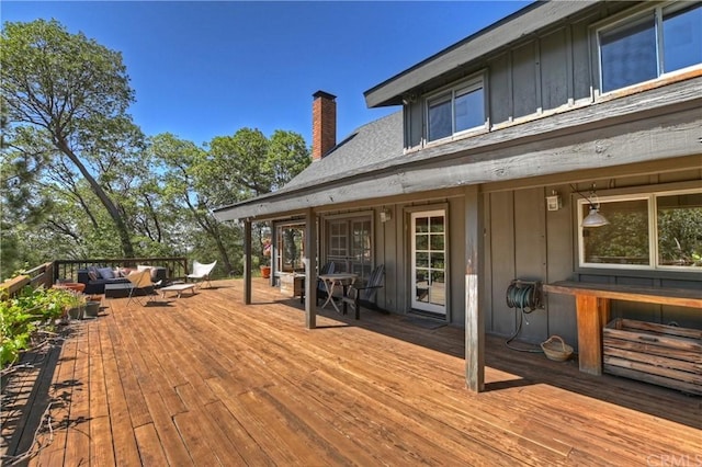 wooden deck with outdoor lounge area