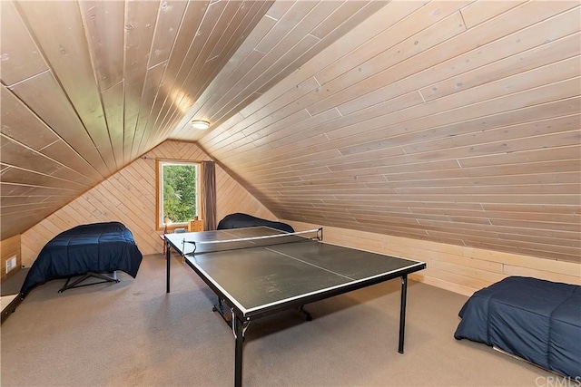 playroom featuring lofted ceiling, wooden walls, carpet flooring, and wooden ceiling