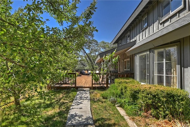 view of yard with a wooden deck