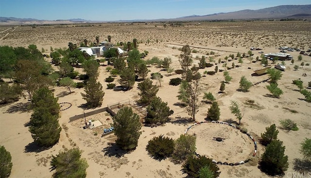 drone / aerial view featuring a mountain view and a rural view