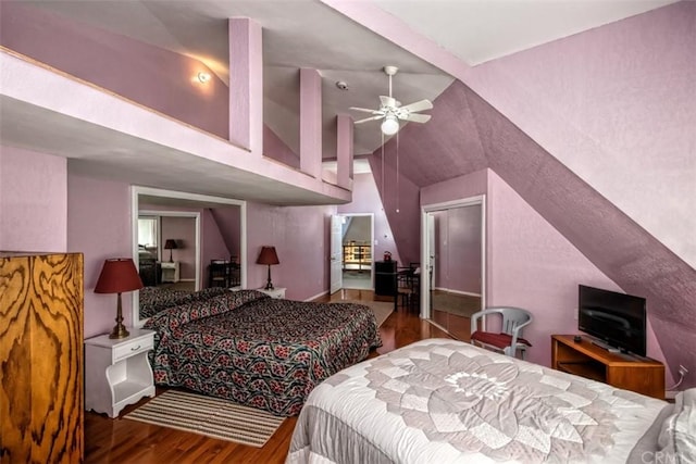 bedroom featuring lofted ceiling, ceiling fan, and wood-type flooring