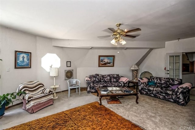 carpeted living room with ceiling fan