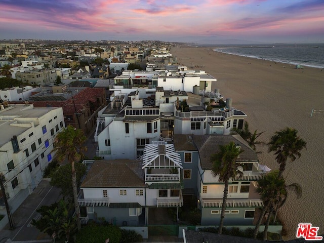 aerial view at dusk with a water view