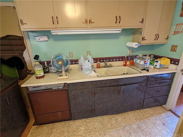 kitchen featuring sink and tile floors