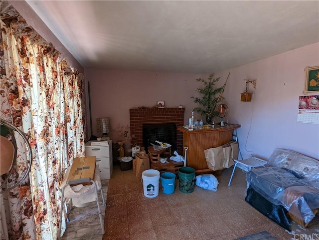 tiled living room featuring a fireplace