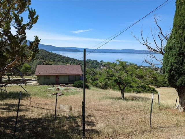 mountain view with a rural view and a water view