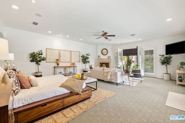 carpeted bedroom with ceiling fan