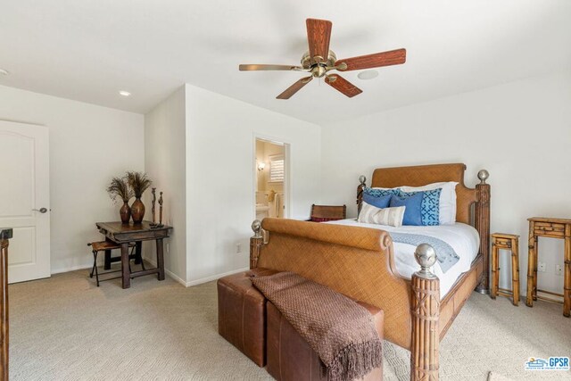 carpeted bedroom with ceiling fan and ensuite bathroom