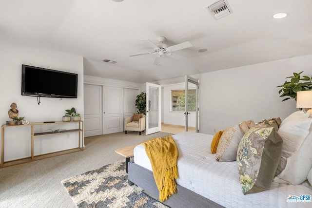 bedroom with ceiling fan, a closet, and light colored carpet