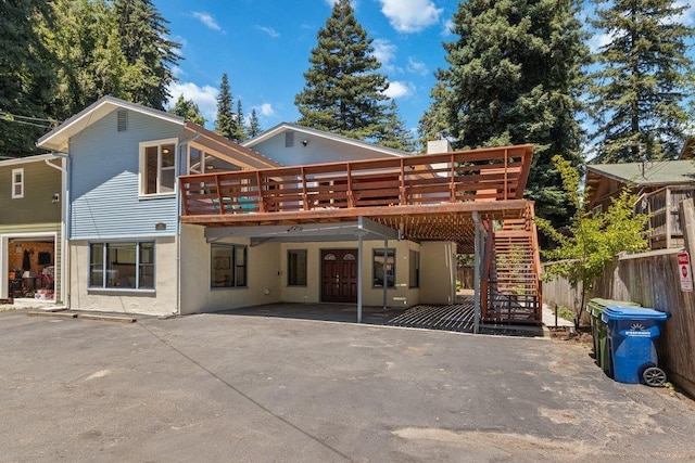 back of property with a patio and a deck