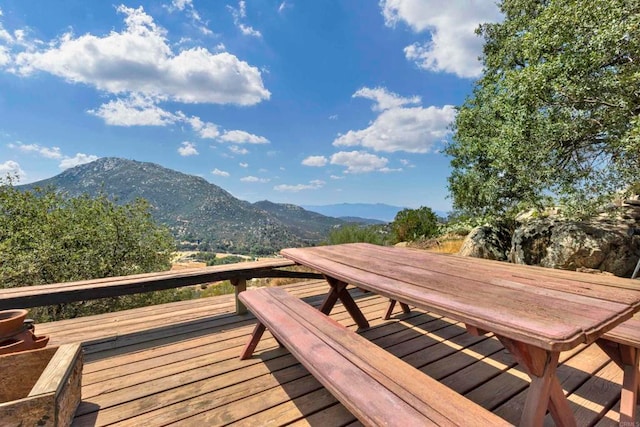 wooden deck featuring a mountain view