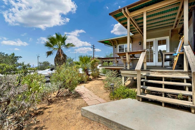 view of yard with french doors