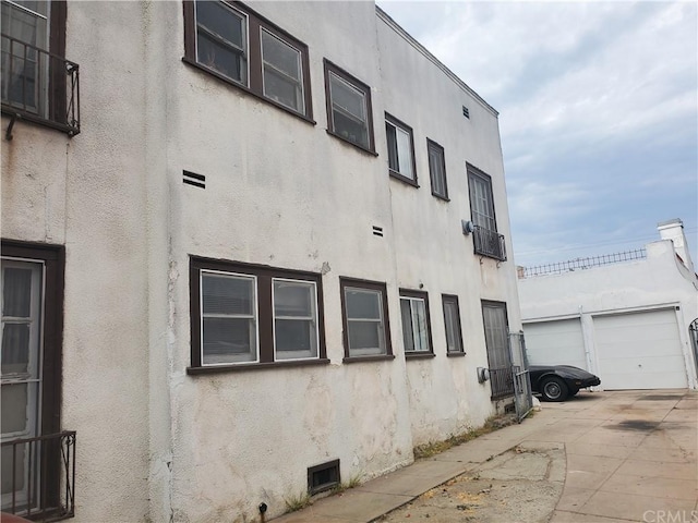 view of side of property with a garage