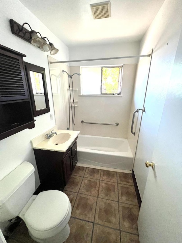 full bathroom featuring shower / washtub combination, tile patterned floors, vanity, and toilet