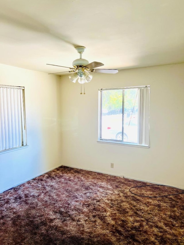 carpeted empty room with ceiling fan