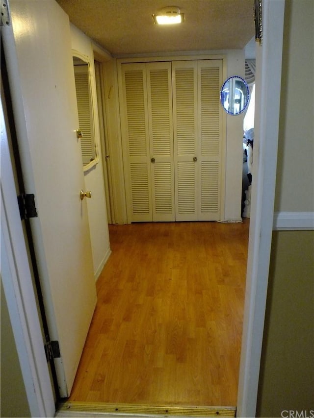 hall with light wood-type flooring