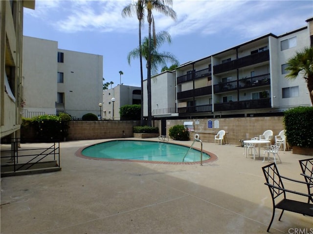 view of swimming pool with a patio