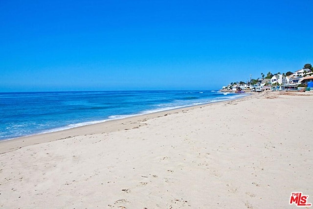 property view of water featuring a beach view