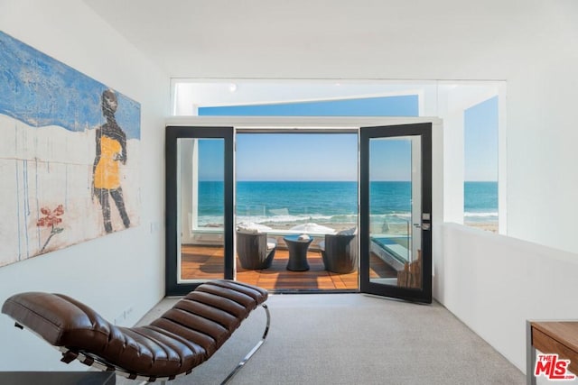 living area with a water view