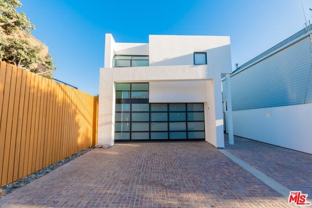 view of front of property with a garage