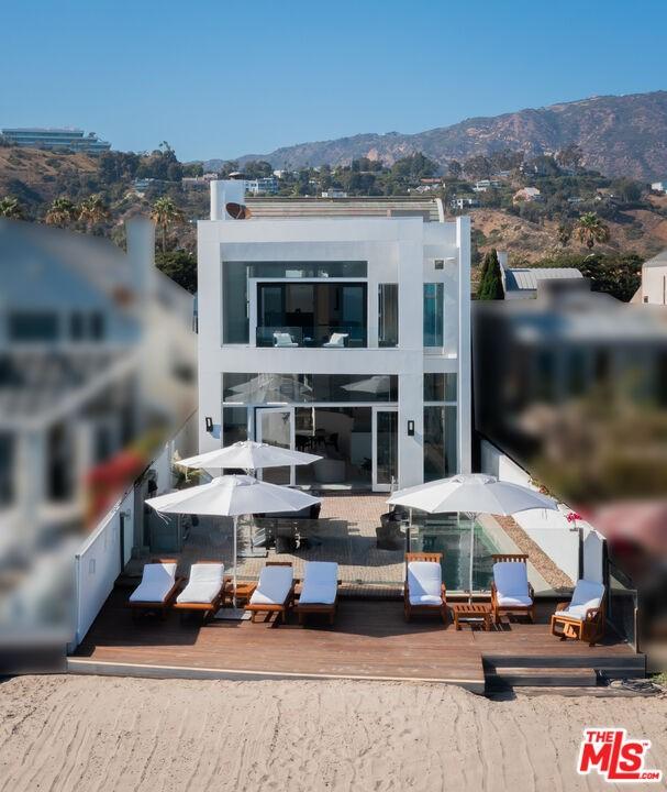 rear view of property featuring a mountain view