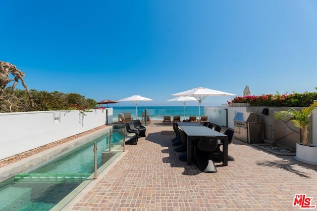 view of patio / terrace featuring a fenced in pool