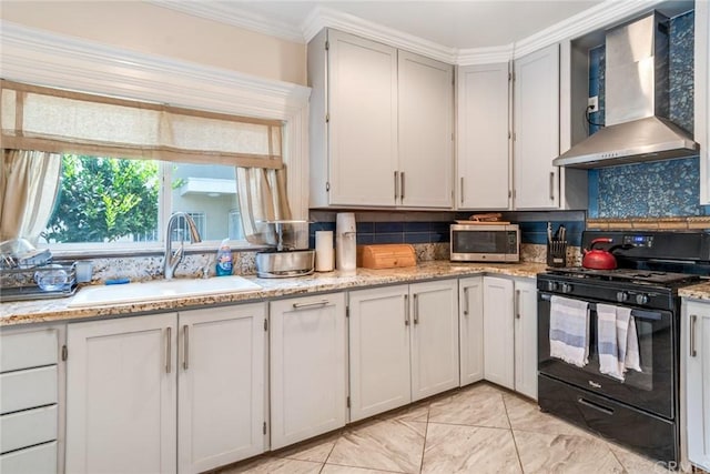 kitchen with backsplash, gas stove, sink, light tile floors, and wall chimney range hood