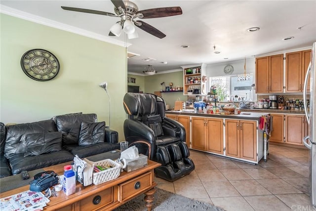 kitchen with crown molding, hanging light fixtures, ceiling fan, and light tile floors